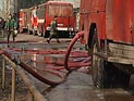 В Москве при пожаре в автошколе погиб человек. Милиция оцепила здание, чтобы не украли оружие