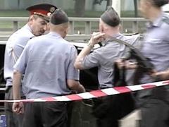 Сотрудники милиции на месте одного из недавних нападений на инкассаторов, кадр НТВ, архив Сотрудники милиции на месте одного из недавних нападений на инкассаторов, кадр НТВ, архив
