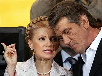 Виктор Ющенко и Юлия Тимошенко. Фото AFP.